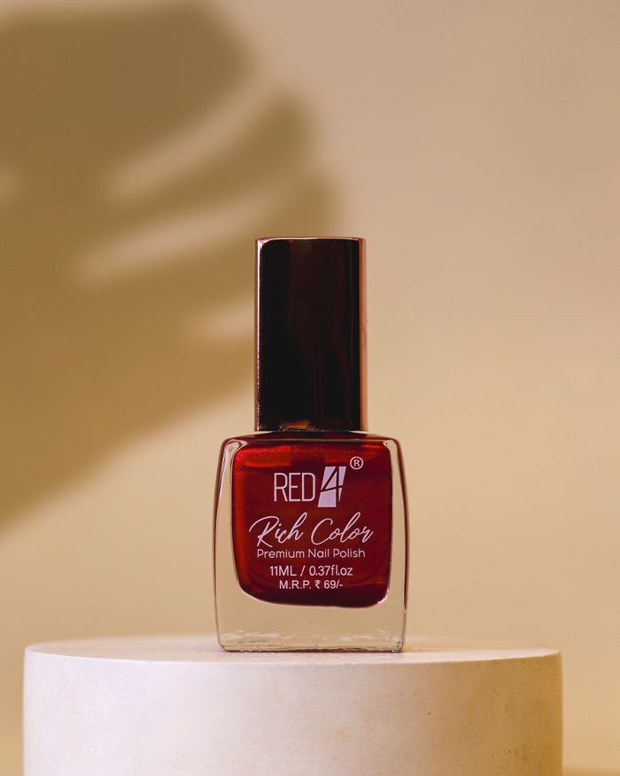 Mastering the First Impression: Your intriguing post title goes here Elegant red nail polish bottle on minimalistic background, perfect for fashion and beauty themes.